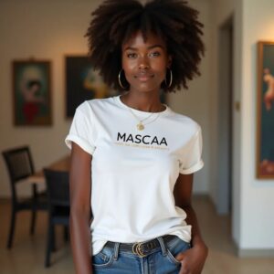 Person wearing white "MASCAA" t-shirt indoors.