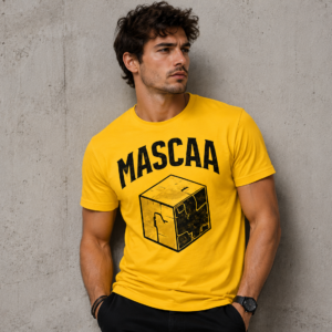 Man wearing yellow graphic t-shirt, concrete background.