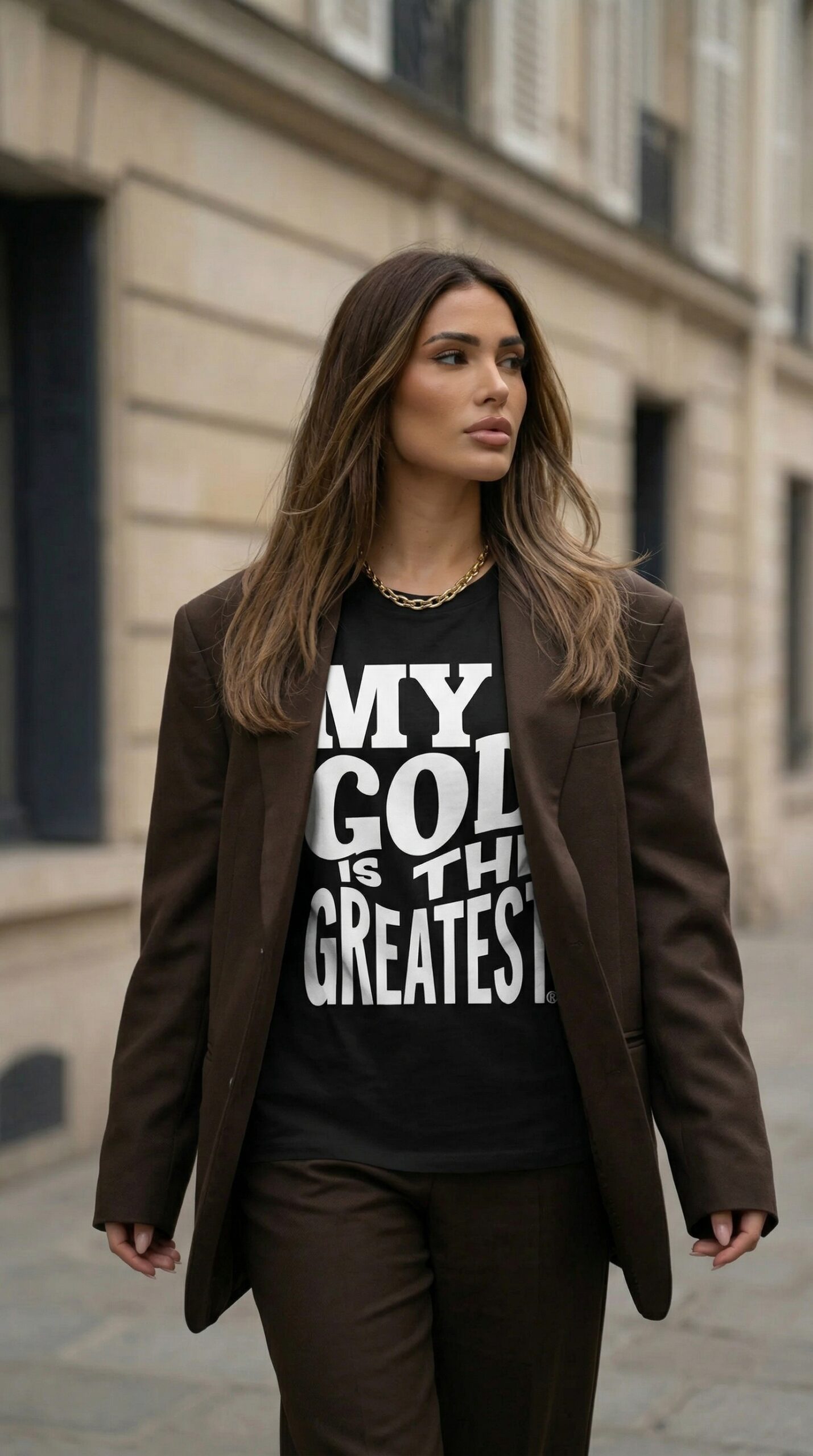 Woman in brown suit walking outside building. Woman in brown suit walking outside building.